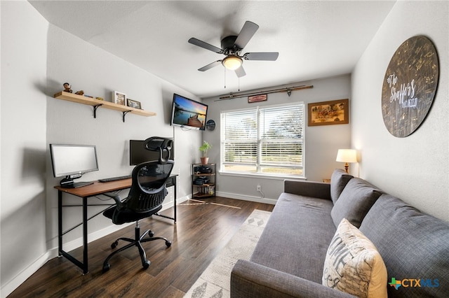 home office with dark hardwood / wood-style floors and ceiling fan