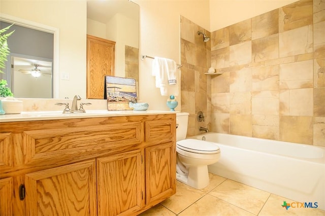 full bath with tile patterned floors, vanity, toilet, and shower / tub combination