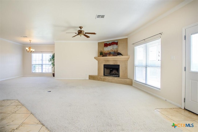 unfurnished living room featuring visible vents, a fireplace, crown molding, and carpet floors