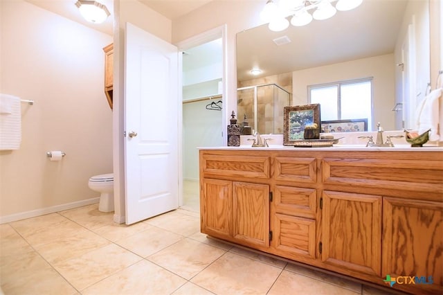 full bathroom featuring visible vents, double vanity, a stall shower, tile patterned floors, and toilet