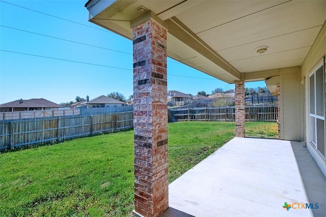 view of yard with a fenced backyard and a patio area