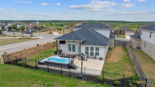 804 Blue Oak Blvd, San Marcos, TX 78666 - rear view of property featuring a residential view, a shingled roof, and a patio