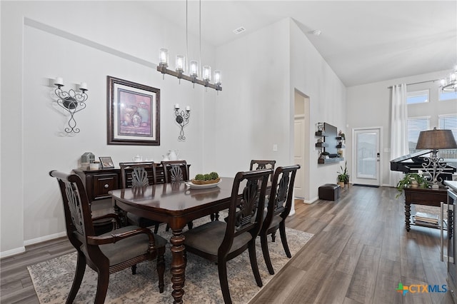 804 Blue Oak Blvd, San Marcos, TX 78666 - dining area with a chandelier, wood finished floors, and baseboards