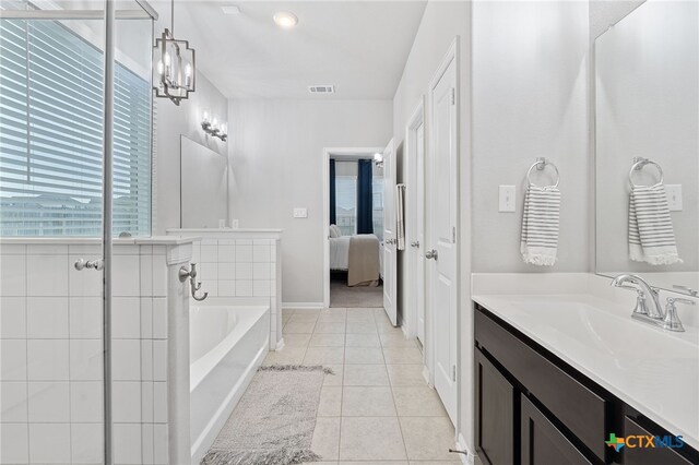 804 Blue Oak Blvd, San Marcos, TX 78666 - full bath with a bath, tile patterned floors, ensuite bath, and vanity