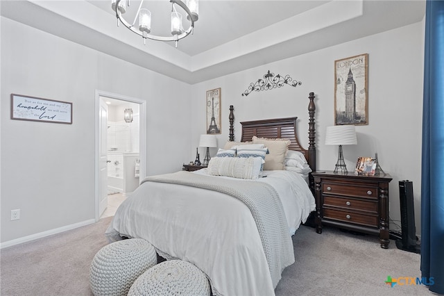 804 Blue Oak Blvd, San Marcos, TX 78666 - bedroom featuring light carpet, a chandelier, a tray ceiling, baseboards, and ensuite bathroom
