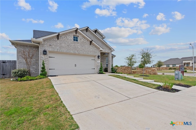 804 Blue Oak Blvd, San Marcos, TX 78666 - view of front of home featuring driveway, a garage, and brick siding