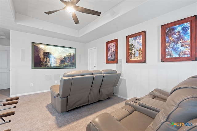804 Blue Oak Blvd, San Marcos, TX 78666 - carpeted cinema room with a ceiling fan, a tray ceiling, and baseboards