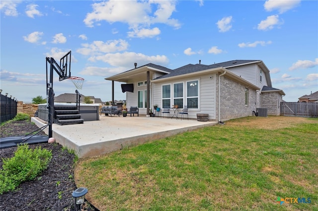 804 Blue Oak Blvd, San Marcos, TX 78666 - rear view of house featuring a patio area, brick siding, central AC unit, and a hot tub
