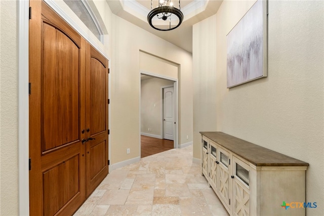 foyer with a tray ceiling