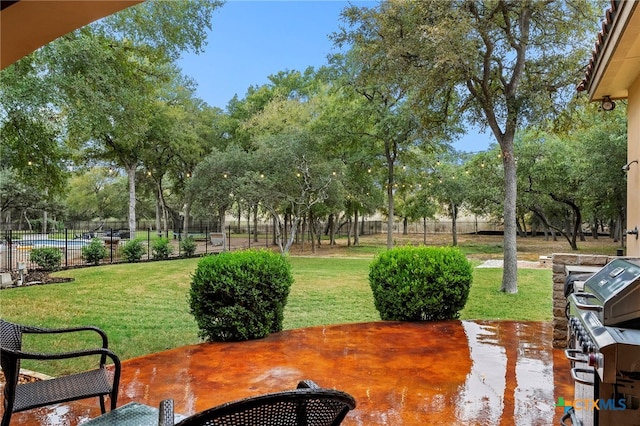 exterior space with a lawn and fence
