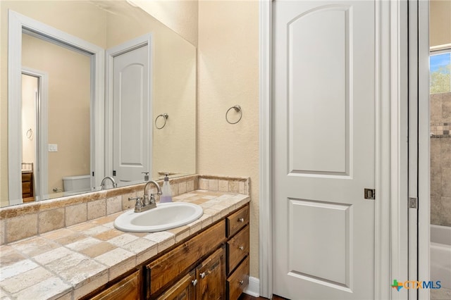 bathroom with vanity and toilet