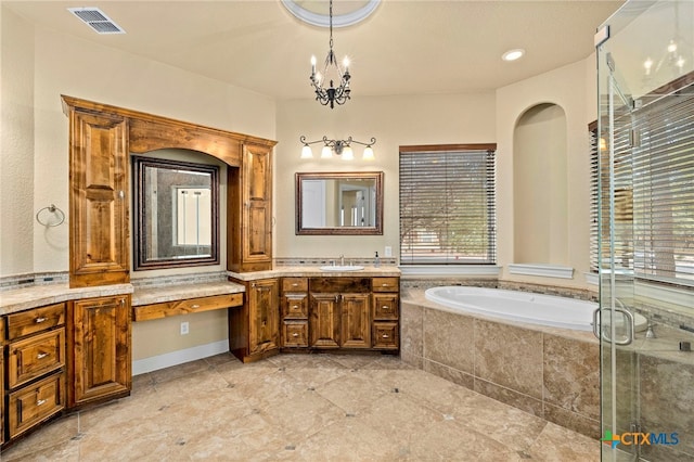 bathroom featuring visible vents, a shower stall, a garden tub, an inviting chandelier, and vanity