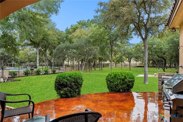 view of home's community featuring a yard and fence