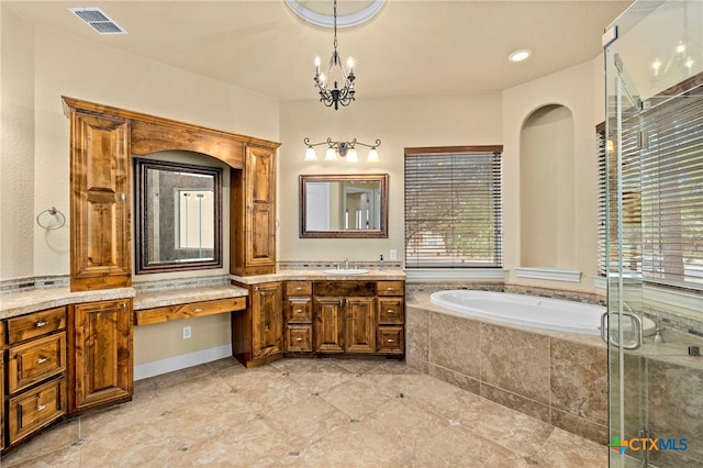 bathroom featuring vanity, independent shower and bath, and an inviting chandelier