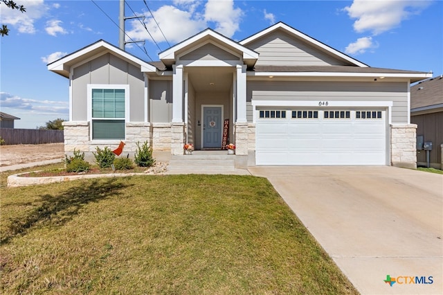 craftsman-style house with a front yard and a garage