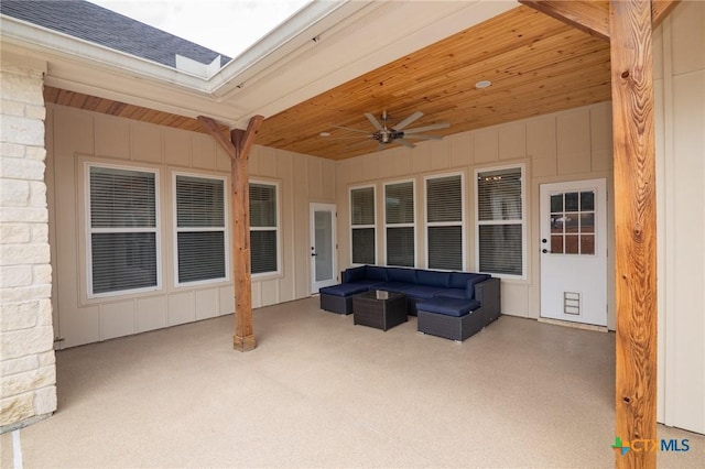 view of patio with an outdoor living space and ceiling fan