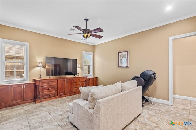 living room with baseboards, a ceiling fan, visible vents, and ornamental molding