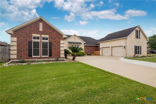 view of front of property featuring concrete driveway, a front lawn, brick siding, and stone siding