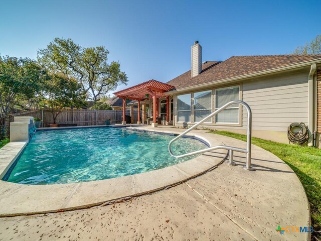 view of pool with a fenced in pool, a pergola, fence, and a patio