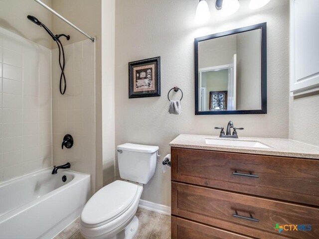 full bathroom featuring shower / washtub combination, toilet, baseboards, and vanity