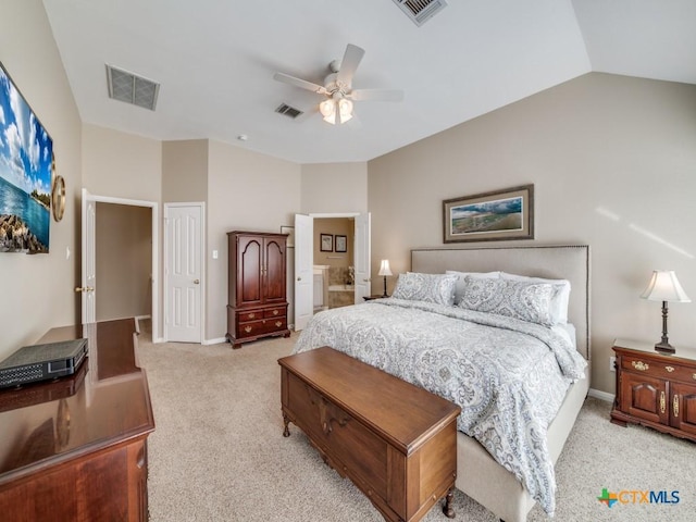bedroom with light carpet, visible vents, and lofted ceiling