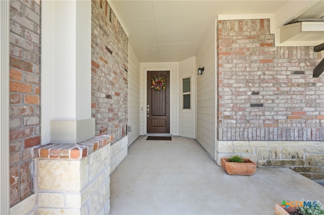 532 Elm Green St, Hutto, TX 78634 - doorway to property with brick siding