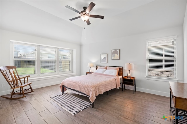 532 Elm Green St, Hutto, TX 78634 - bedroom featuring vaulted ceiling, wood finished floors, and a ceiling fan