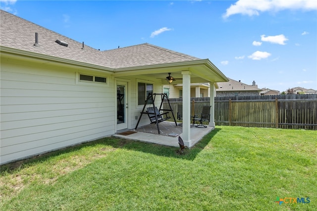 532 Elm Green St, Hutto, TX 78634 - rear view of house with roof with shingles, a patio, and a ceiling fan