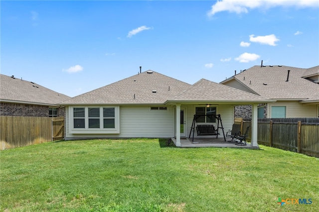 532 Elm Green St, Hutto, TX 78634 - rear view of house with a patio area, a fenced backyard, and a shingled roof