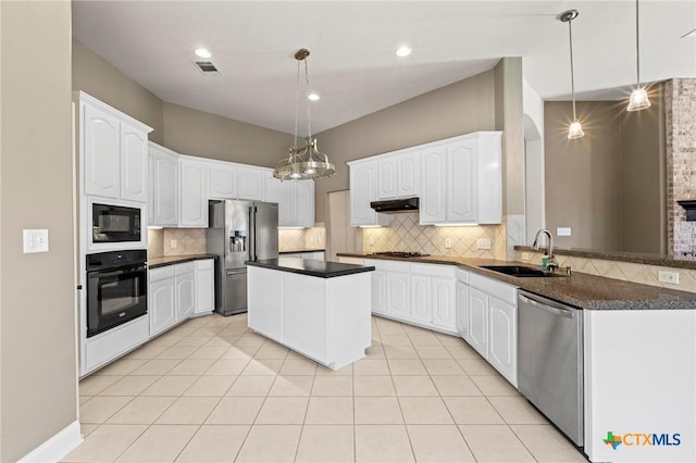 1428 Windcrest Dr, Round Rock, TX 78664 - kitchen featuring a sink, black appliances, dark countertops, and under cabinet range hood