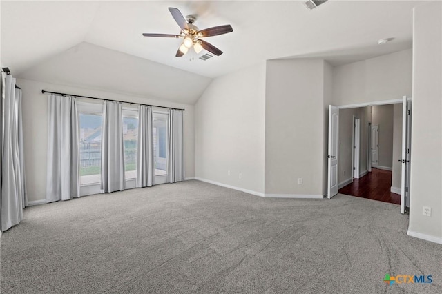 1428 Windcrest Dr, Round Rock, TX 78664 - carpeted empty room featuring ceiling fan, vaulted ceiling, and baseboards