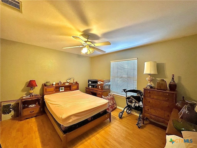 203 Canyon Crk, Victoria, TX 77901 - bedroom with light wood-style flooring and a ceiling fan
