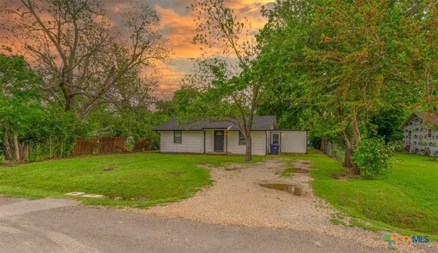 303 Sumbera St, Holland, TX 76534 - view of front of home with fence, dirt driveway, and a front yard