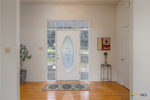 entryway with light hardwood / wood-style floors