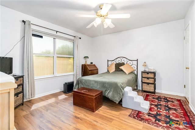 2039 Cornerstone Dr, New Braunfels, TX 78130 - bedroom with wood finished floors and a ceiling fan