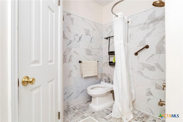 2039 Cornerstone Dr, New Braunfels, TX 78130 - bathroom featuring a tile shower, tile walls, and a bidet