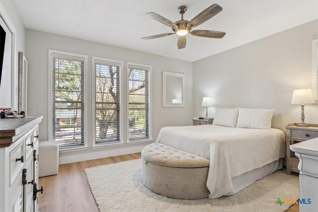 bedroom featuring ceiling fan and light wood-style flooring