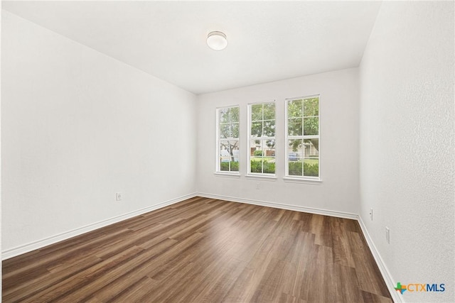 809 Filly Ln, Temple, TX 76504 - unfurnished room featuring dark wood-style floors and baseboards