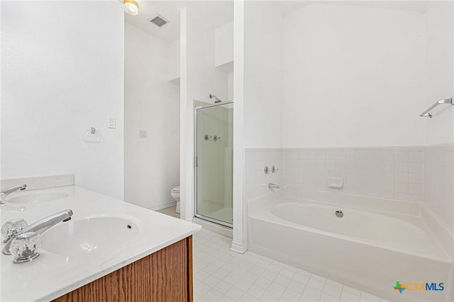 809 Filly Ln, Temple, TX 76504 - bathroom with a shower stall, double vanity, a bath, and tile patterned floors