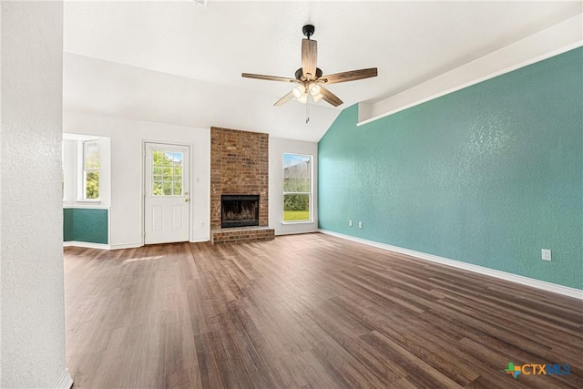 809 Filly Ln, Temple, TX 76504 - unfurnished living room with lofted ceiling, ceiling fan, wood finished floors, a textured wall, and baseboards