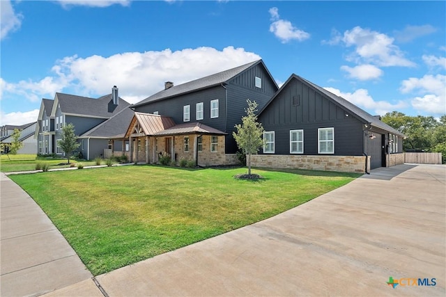 8300 Spicewood Springs Rd, China Spring, TX 76633 - view of property exterior featuring board and batten siding, concrete driveway, a yard, stone siding, and an attached garage