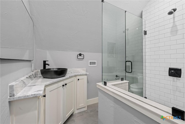 8300 Spicewood Springs Rd, China Spring, TX 76633 - full bath with a shower stall, lofted ceiling, vanity, and toilet