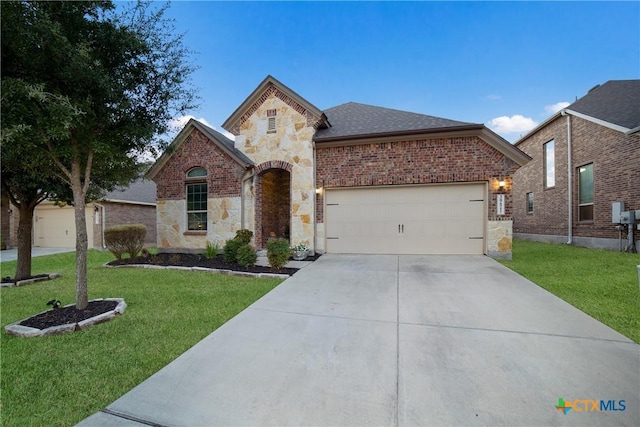 front of property with a front lawn and a garage