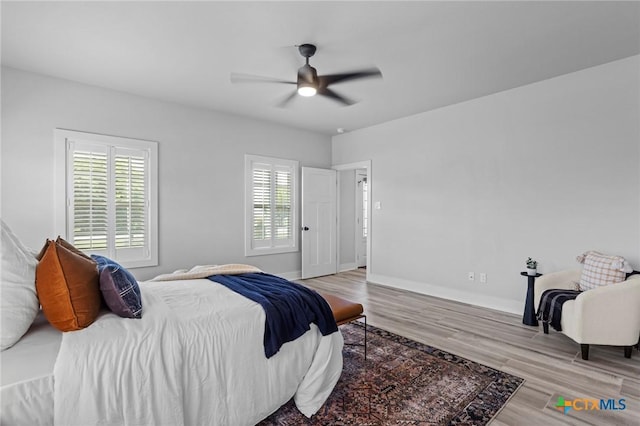 4430 Cedar Creek Rd, Temple, TX 76504 - bedroom with multiple windows, wood finished floors, and ceiling fan