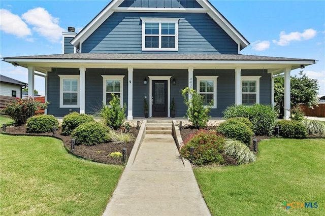4430 Cedar Creek Rd, Temple, TX 76504 - view of front of property with a front yard, a porch, roof with shingles, and a chimney