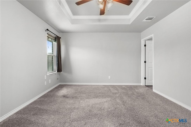 2550 Belle Hubbard Trl, Belton, TX 76513 - empty room featuring a tray ceiling, a ceiling fan, carpet, and crown molding