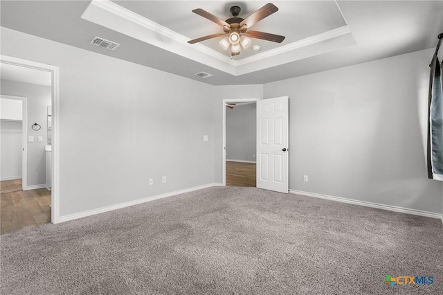 2550 Belle Hubbard Trl, Belton, TX 76513 - spare room with a raised ceiling, ceiling fan, carpet flooring, and crown molding