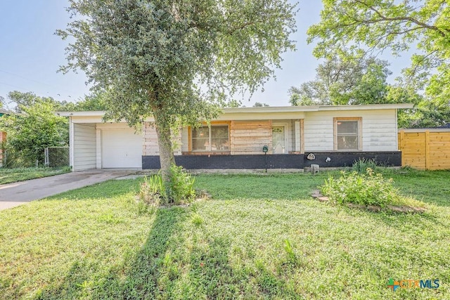 1905 S 53rd St, Temple, TX 76504 - ranch-style home featuring concrete driveway, a front lawn, fence, and an attached garage