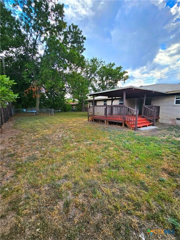 view of yard with a deck