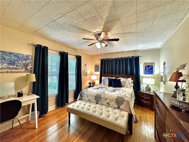 bedroom featuring light wood-style floors and ceiling fan